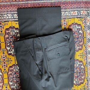 𝅺MICHAEL Kors creased and cuffed capris in black with buttoned back pockets.